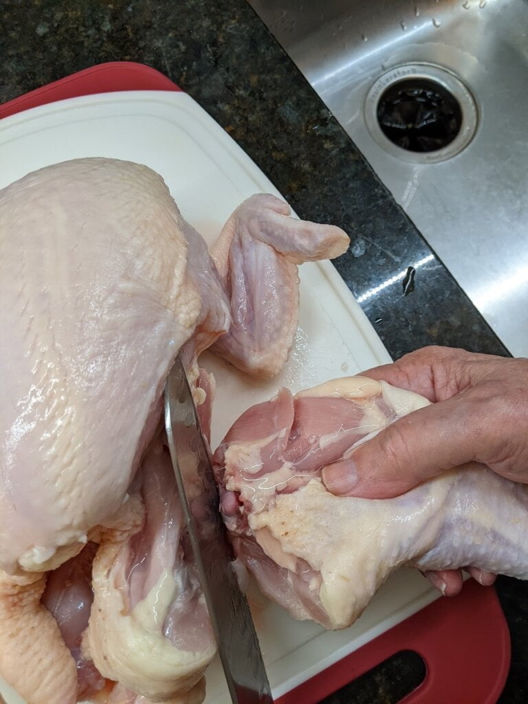 03 cut into chicken leg with thigh