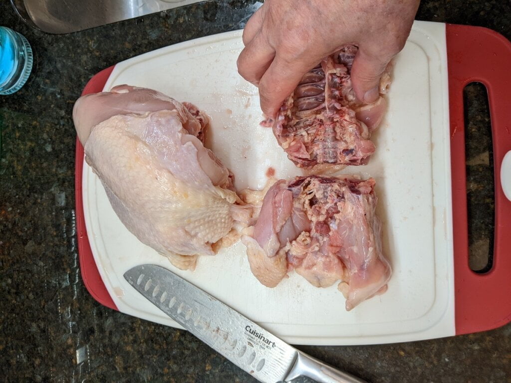 05 cut chicken back in half and discard lesser half