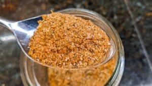 14 herbs and spices mixed to make southern seasoning for chicken