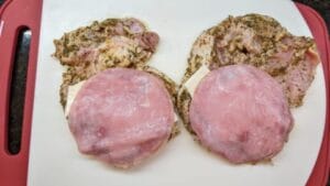 1st layer of deli ham applied to grilled cuban stuffed pork chops recipe
