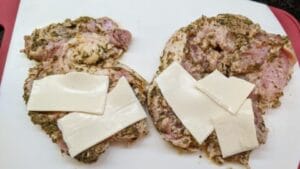 1st layer of swiss cheese applied to pan fried cuban stuffed pork chops recipe
