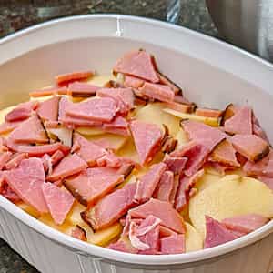 2 Layers of Sauce Onions Potatoes Ham in Casserole for Cheesy Scalloped Potatoes and Ham