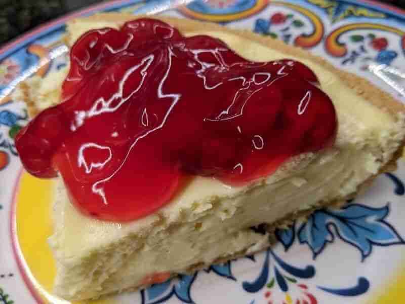 Cheesecake with cherry topping serving