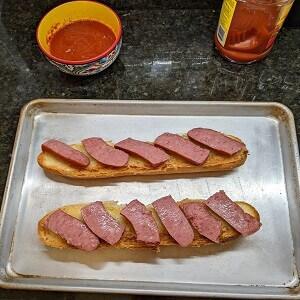 Distribute-the-kielbasa-on-the-bread-medium-1