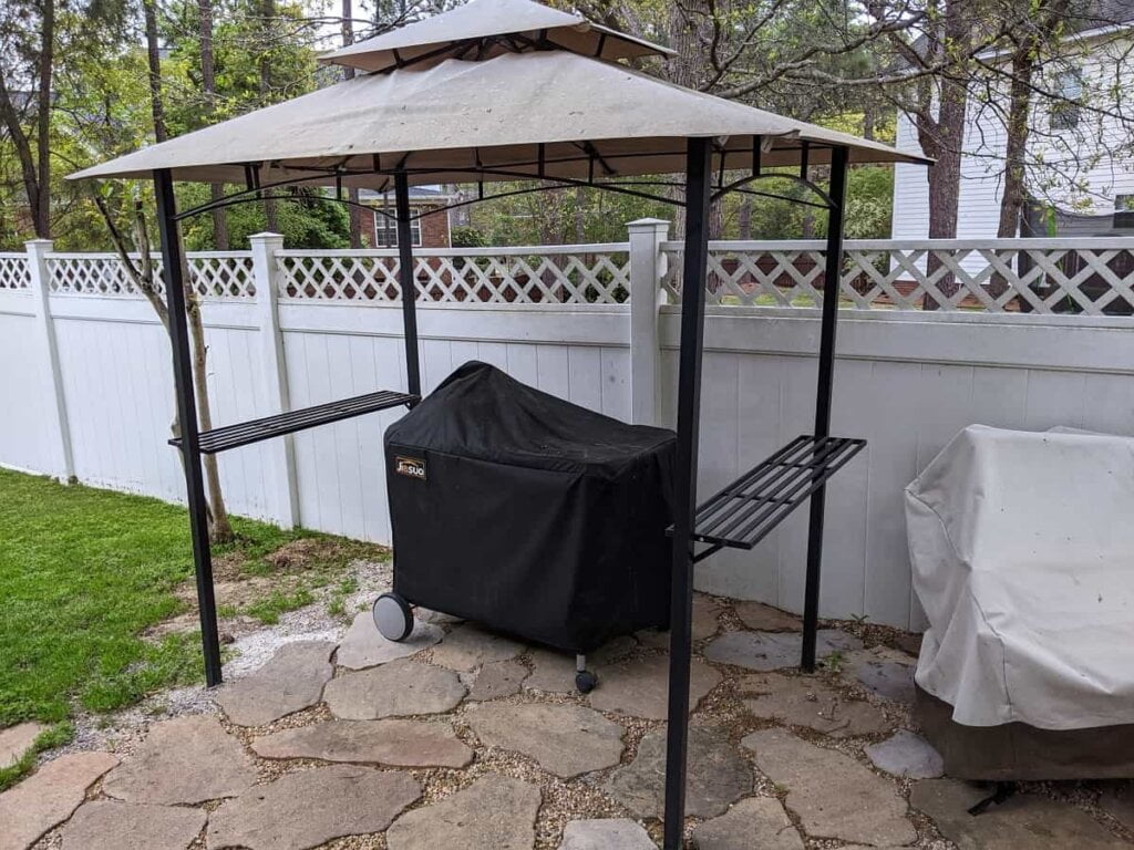 a grill canopy helps with wind and weather and a supporting grill cover helps in-between sessions