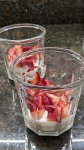 Add diced strawberries to each cup for strawberry yogurt granola parfait recipe