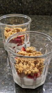 Add granola to each cup for strawberry yogurt granola parfait recipe