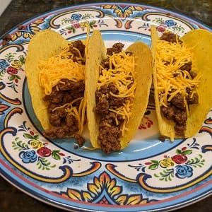 Add-shredded-cheese-medium add shredded cheese to taco ground beef