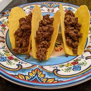 Add-taco-meat add taco meat to taco shell