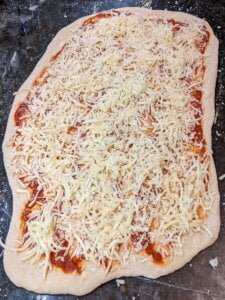 03-Add-the-cheeses-view-medium Add the cheeses for recipe for supreme pizza