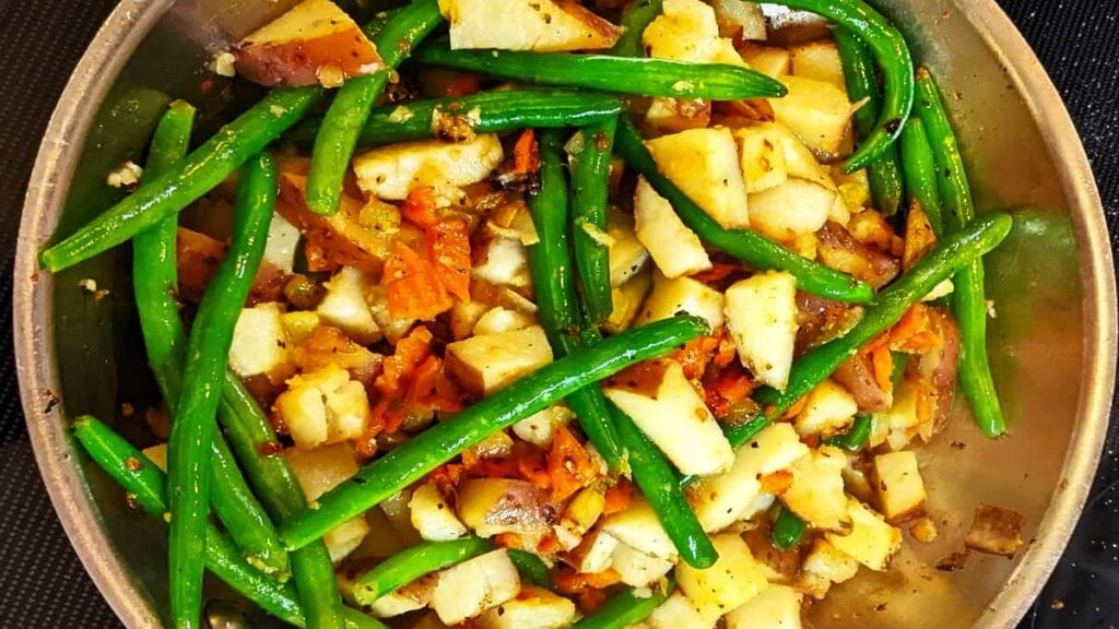 added potatoes and spices to skillet for potatoes with green beans recipe