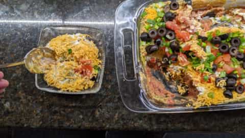 adding 7 layer dip to individual serving dish