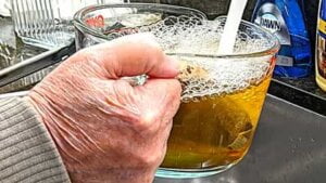 adding final water over tea bags for making southern sweet tea