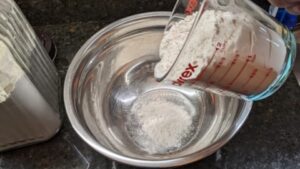 adding flour to make dry pancake mix recipe