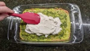 adding layer 3 of sour cream to 7 layer dip recipe
