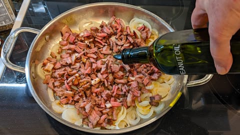 adding oil to skillet for making grilled steak sandwich recipe