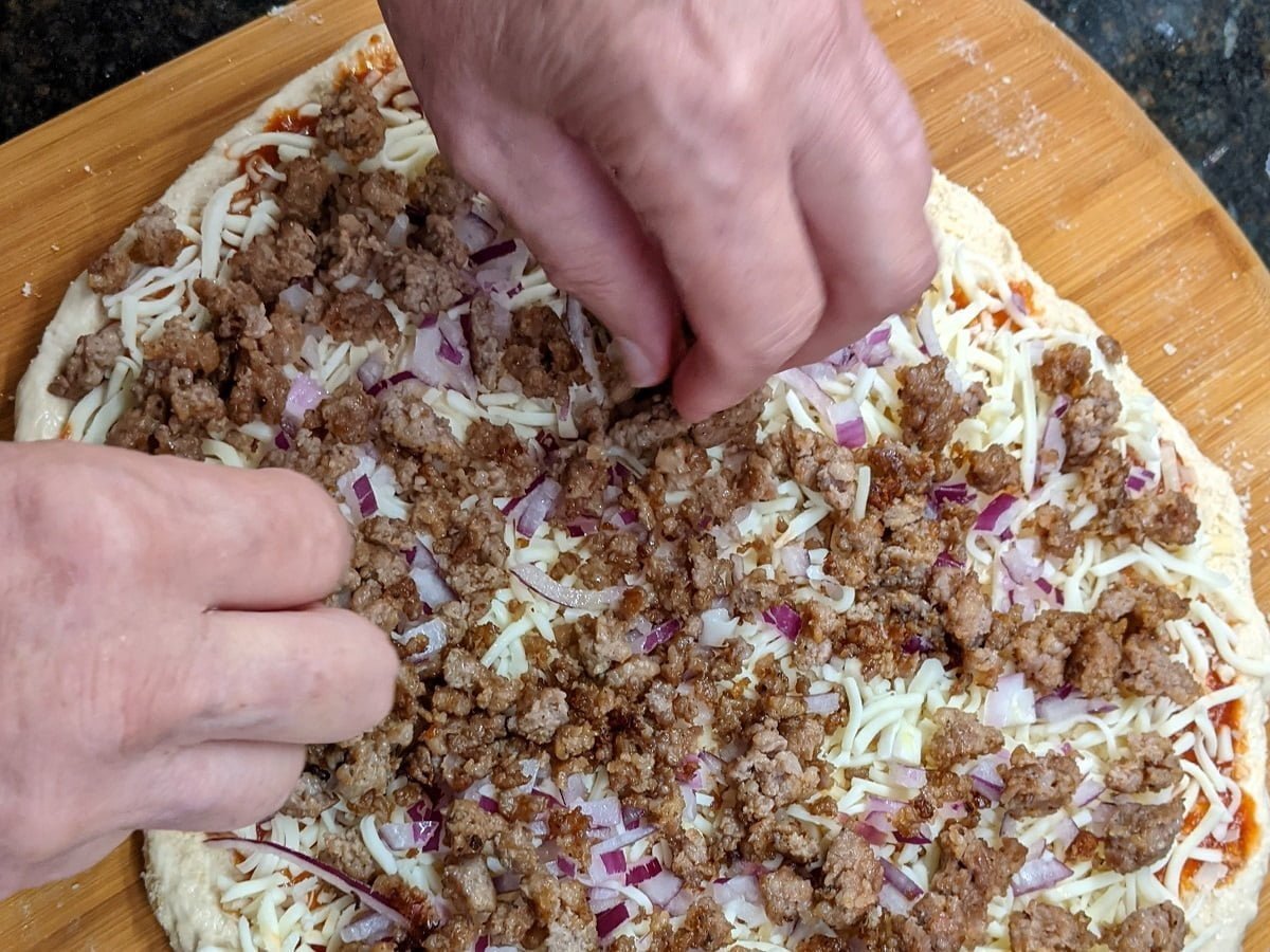 Adding pork sausage topping to pepperoni sausage pizza