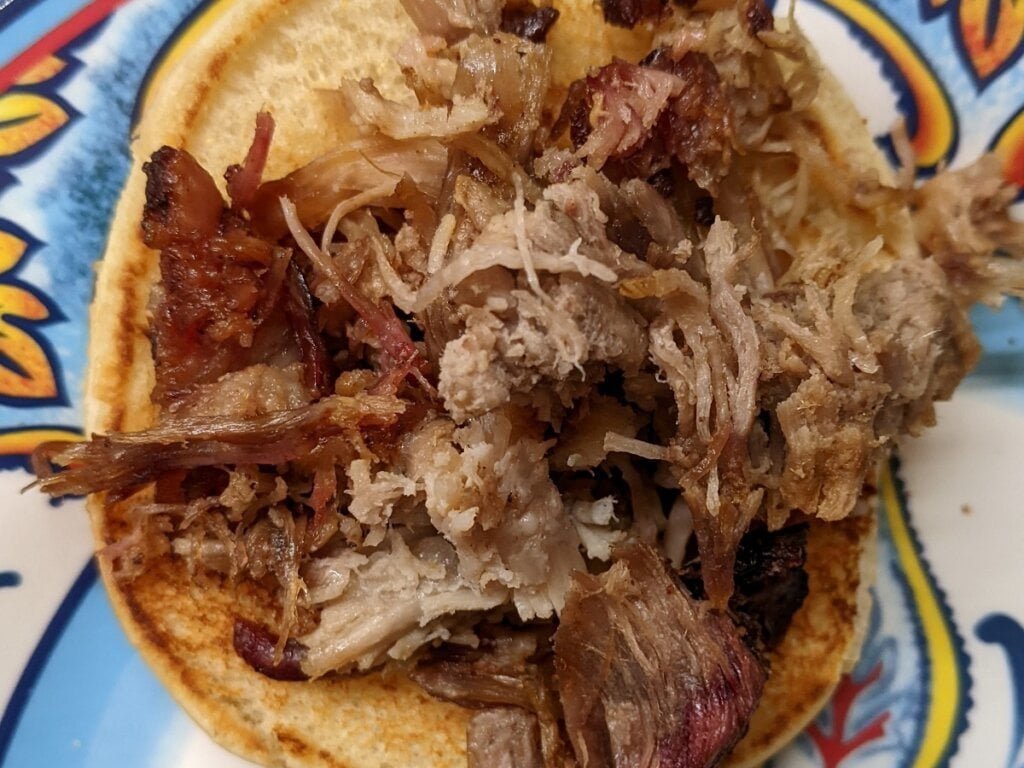 how to make a pulled pork sandwich - adding meat