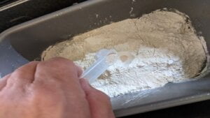 Adding yeast in a crater for white bread in bread machine