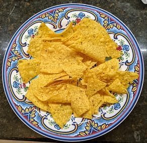 Building ground beef nachos starting with tortilla chips