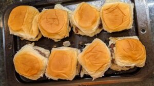 burger sliders on steam tray ready for oven