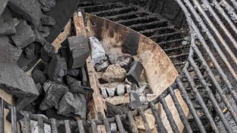 center of grill grate removed for refilling charcoal center of grill grate removed for refilling charcoal