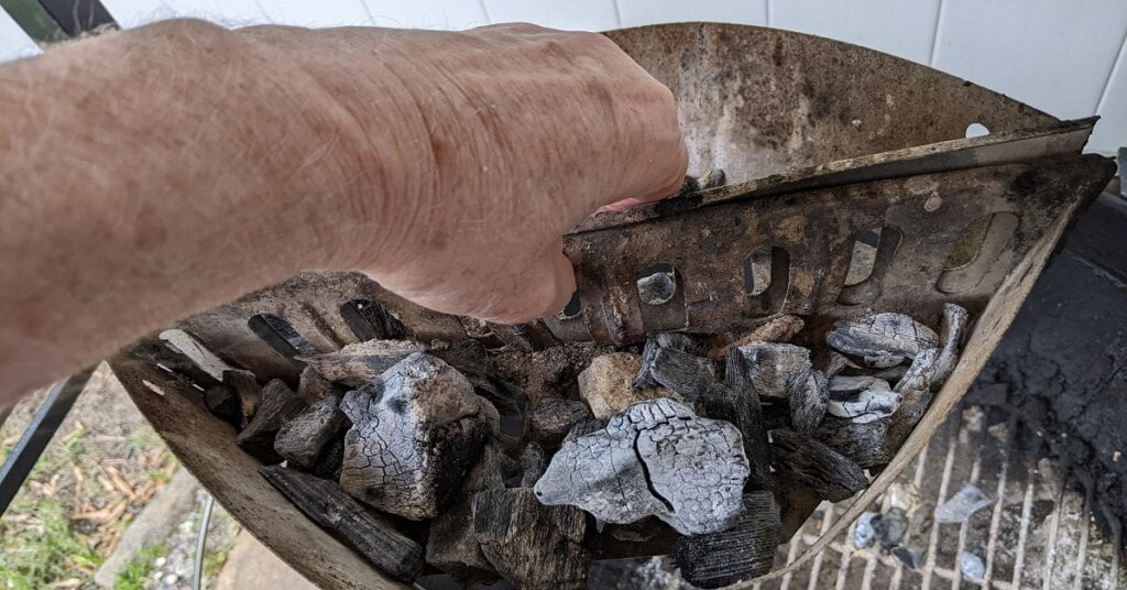 maintaining a charcoal grill charcoal bins