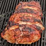 checking-pulled-pork-on-a-charcoal-grill-after-1-hour-1