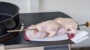 chickens skewered into spit ready for rotisserie