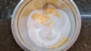 combining dry ingredients to make southern cornbread loaf recipe
