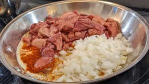 combining ingreditents in bowl for chicken liver pate recipe