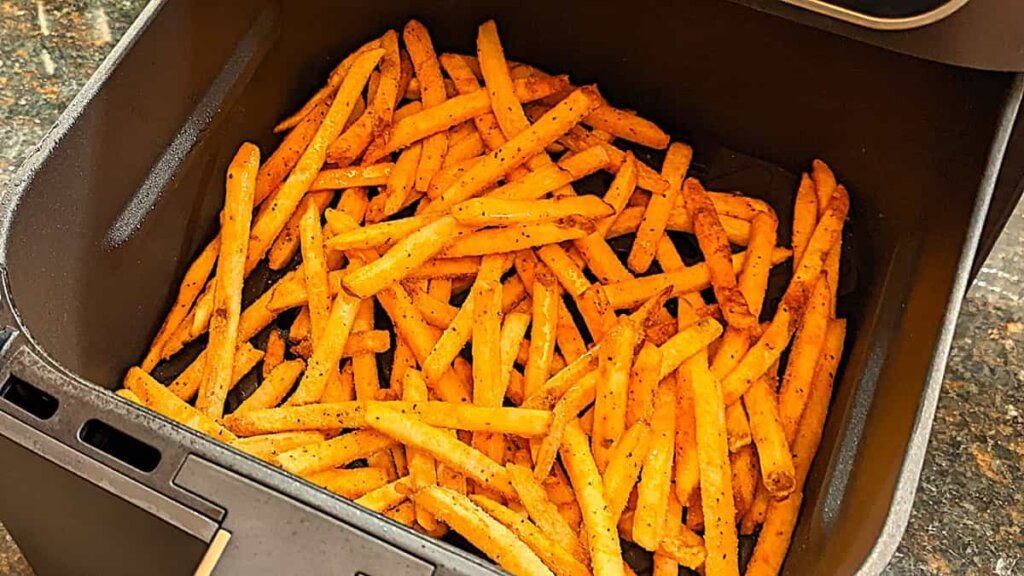 cook frozen fries in the air fryer until desired doneness