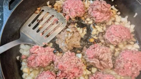 cook small slider burger patties in onions and smash over turning over cook small slider burger patties in onions and smash over turning over