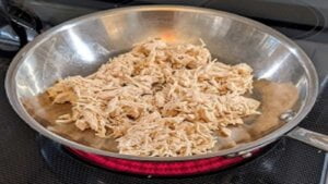 cook the shredded chicken for chicken nachos