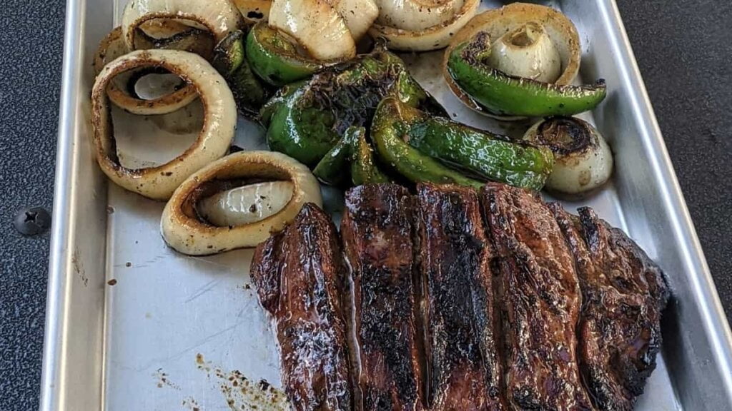 cooked meat and veggies for steak fajitas grill recipe