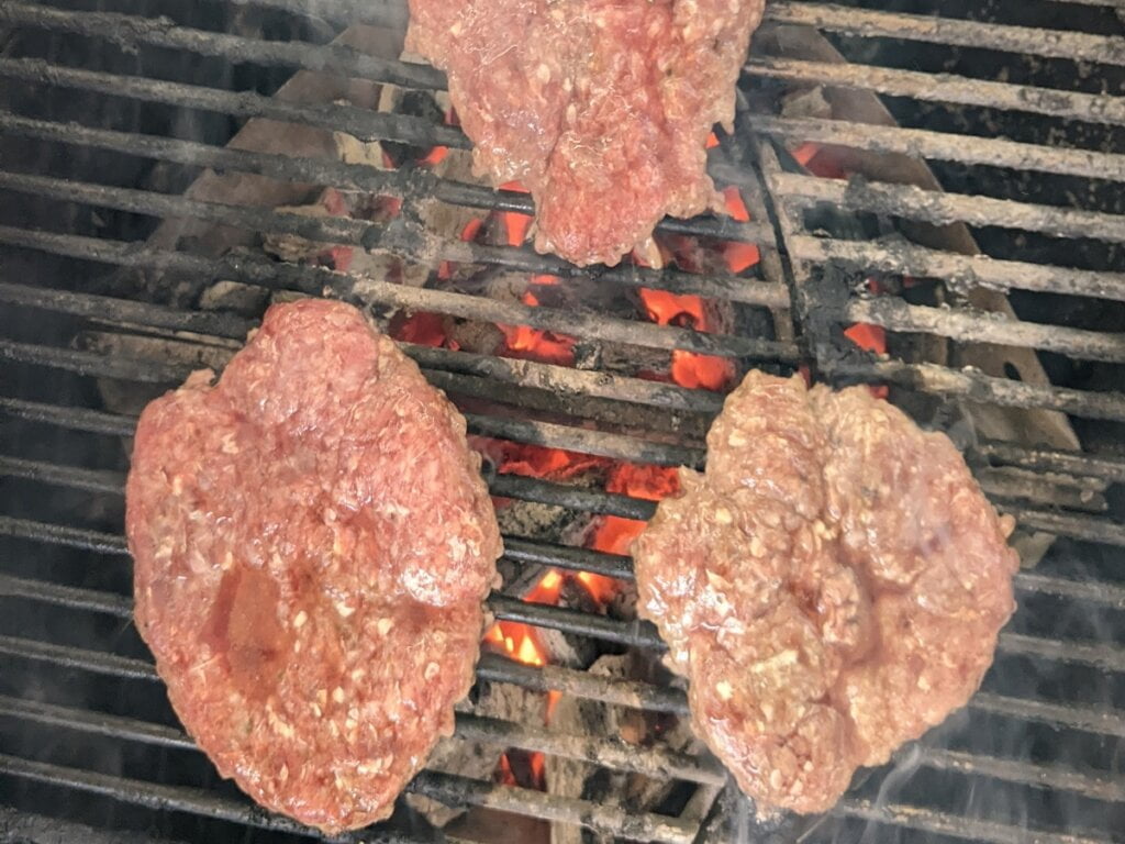 cooking one side of frozen patties almost ready to turn