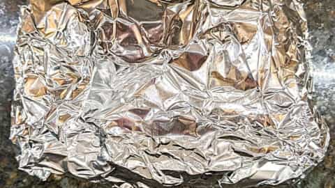 corn on the cob in the oven in foil ready for baking