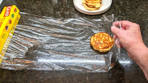 covering first pancake in plastic wrap for storage