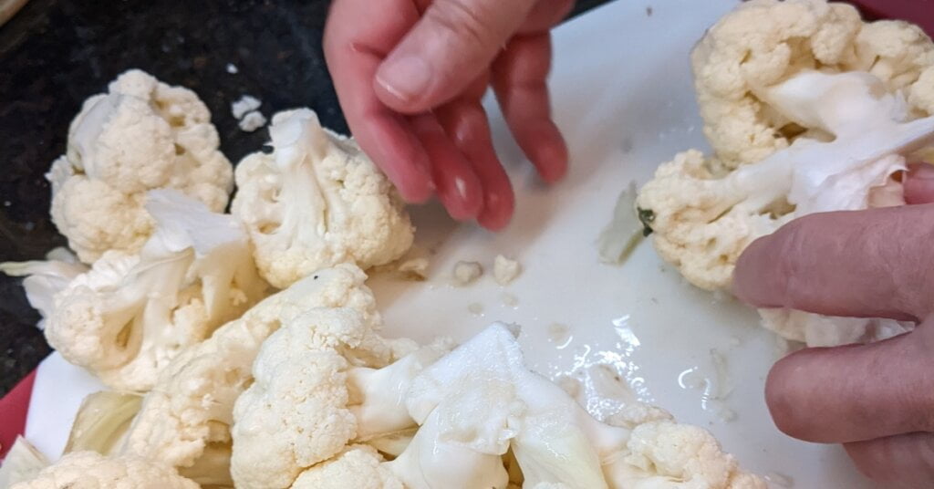 cut bases of all sections of cauliflower to have large pieces