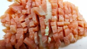 cut up chicken into cubes for chicken with saffron rice casserole recipe