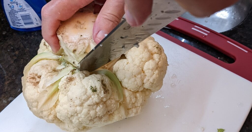 cutting to remove final cauliflower leaves