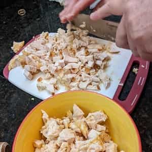 cutup the cooked chicken or other meat for how to make burrito bowls at home