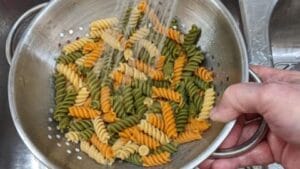 drain cooked pasta for antipasto tortellini salad recipe