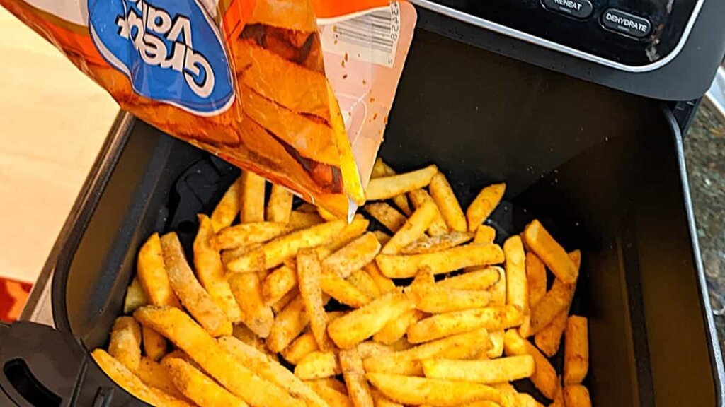 dump in the frozen fries into the preheated air fryer