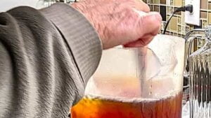 final stirring of pitcher of southern sweet tea recipe