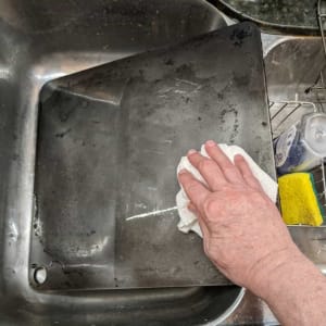 finish cleaning by wiping pizza steel dry with paper towels
