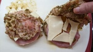 folding empty layer onto layered half for grilled cuban stuffed pork chops recipe