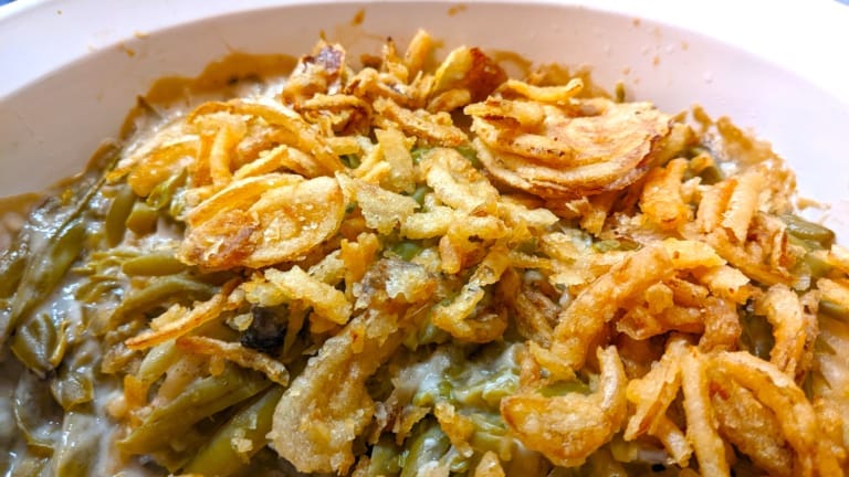 frenched green bean casserole with crispy onion topping golden brown