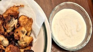 fried mushroom dipping sauce being used