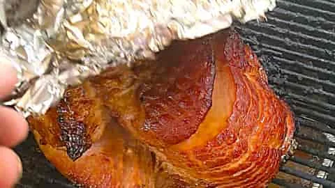 grill a spiral ham and make it have a caramelized honey baked glaze